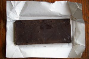 An unwrapped bar of chocolate as seen from above