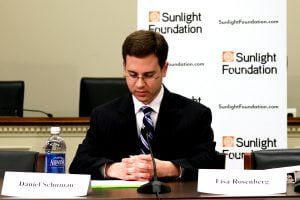 Daniel Schuman sits at an ACT event and prepares remarks.