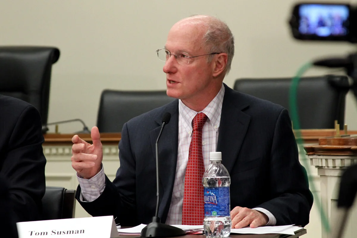 Tom Susman gestures as he speaks on a Hill panel.