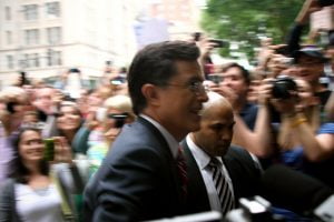 Colbert Show host Steven Colbert moves through the crowd as he enters the FEC headquarters in Washington DC.