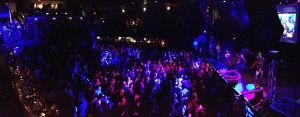 A panoramic photo of a dance party at the 9:30 Club in Washington DC.