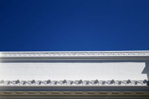 Blue sky against the top portion of the Internet Archive building with the text from the former Fourth Church of Christ, Scientist church in San Francisco.