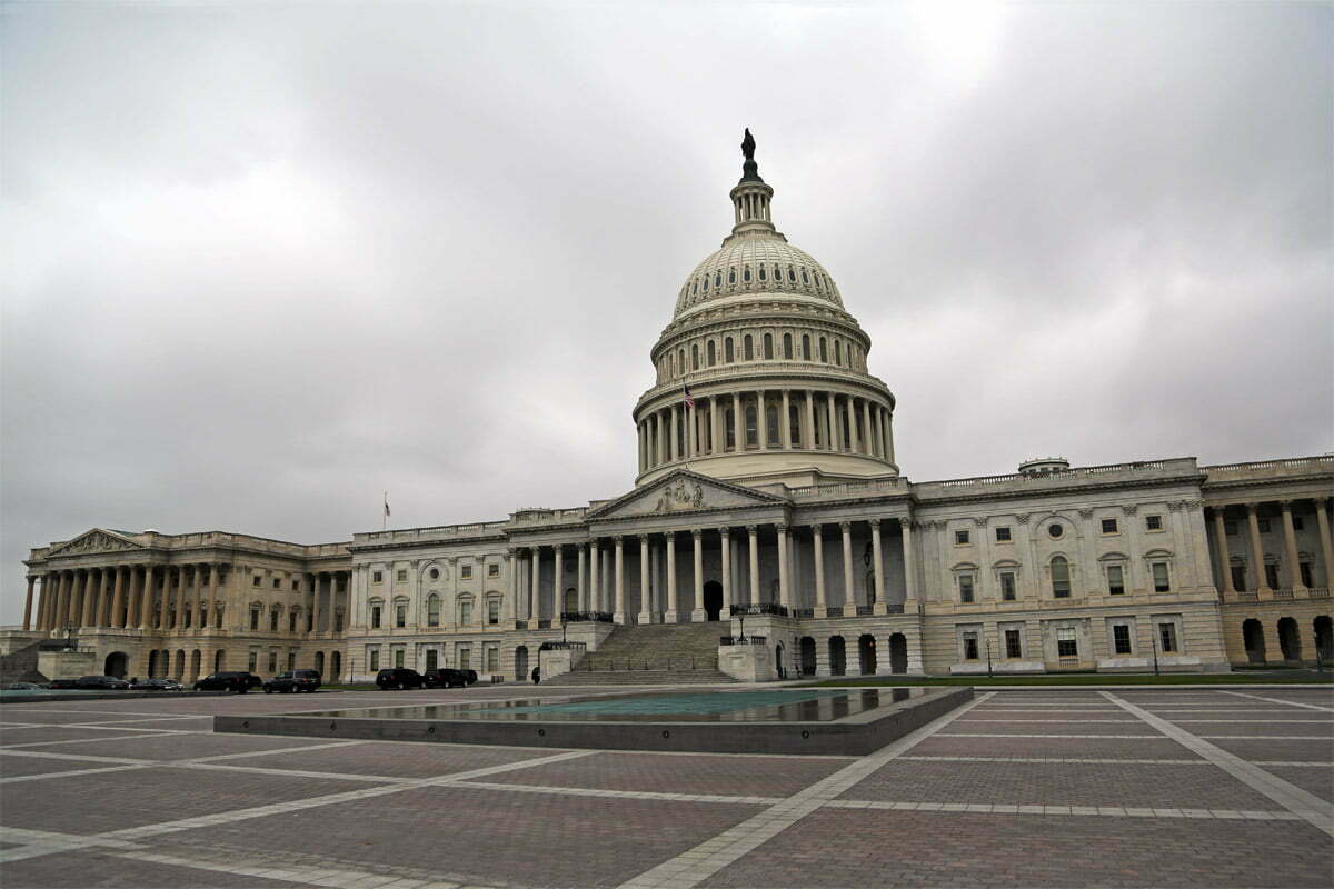 The U.S. Capitol Building on a cloudy day with no people in sight in Washington D.C.