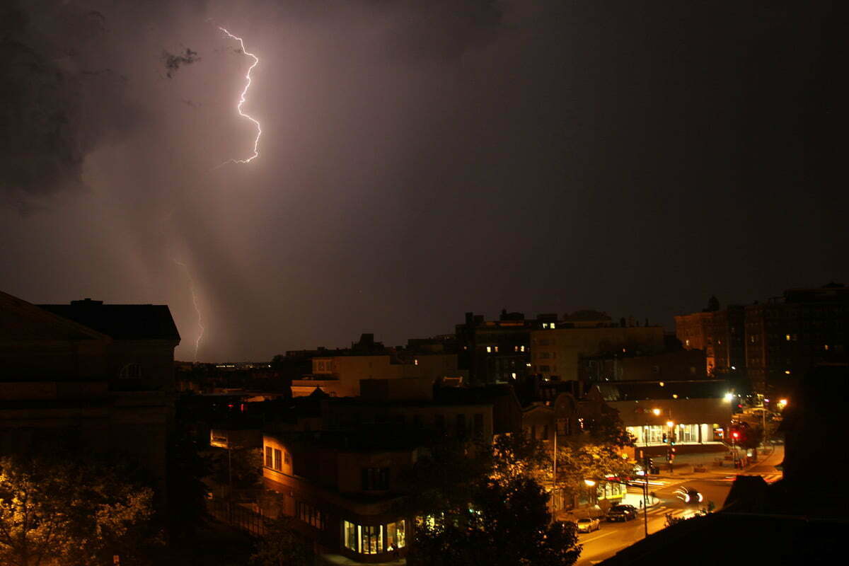 A lightning bolt strikes in the distance during a heat lightning storm in Washington DC.