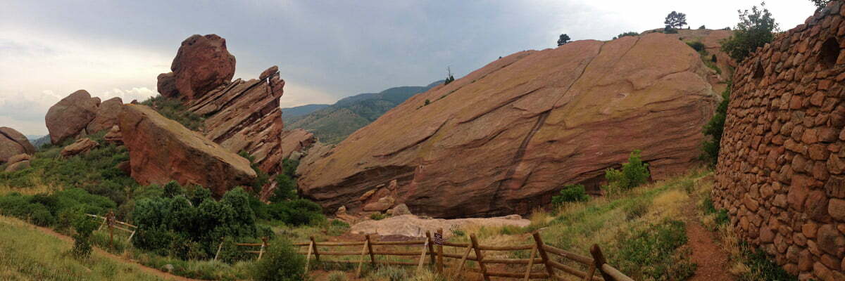 A panoramic photo of the dramatic sandstone outcroppings on a hike in Red Rocks Park near Denver, Colorado.