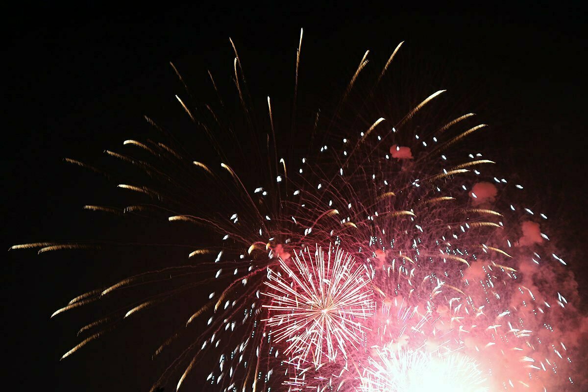 Bright and colorful fireworks go off over the National Mall in Washington DC.