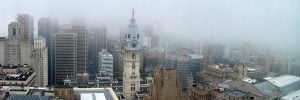 A view of the skyline of Philadelphia and city hall on a very cloudy day.