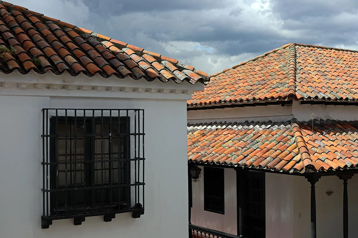 The tiled rooftops, windows and patio of the Botero Museum in Bogota, Colombia.