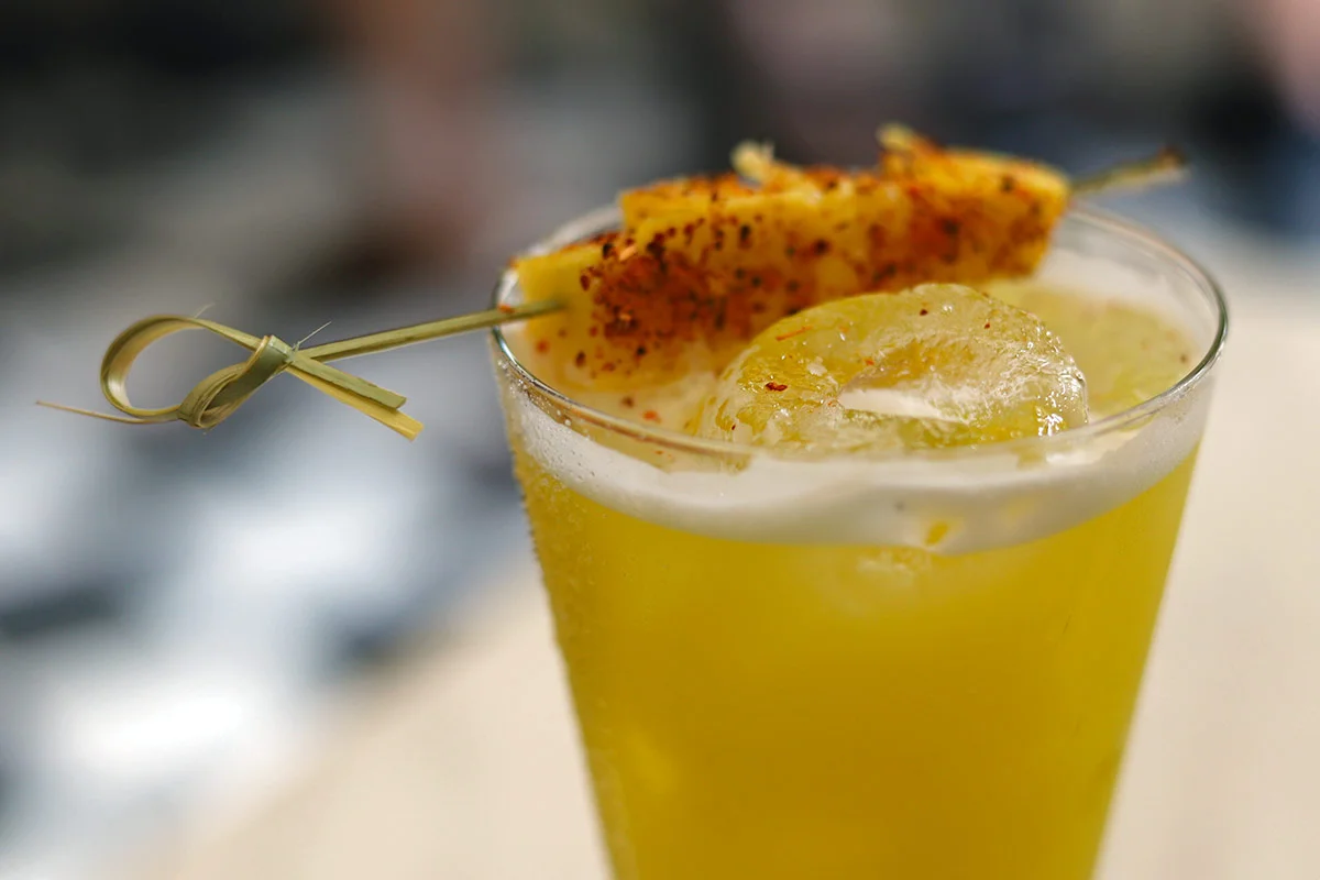 A spicy mezcal cocktail with pineapple, spices and ginger syrup seen in the Old Walled City of Cartagena, Colombia.